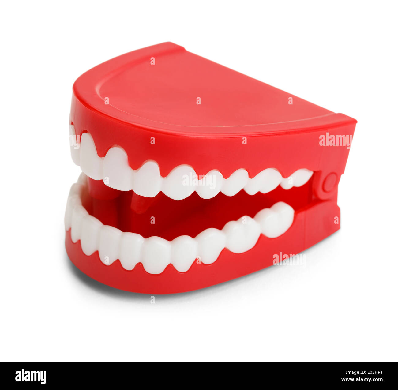 Rosso in plastica avvolgere Chatttering denti. Isolato su sfondo bianco. Foto Stock