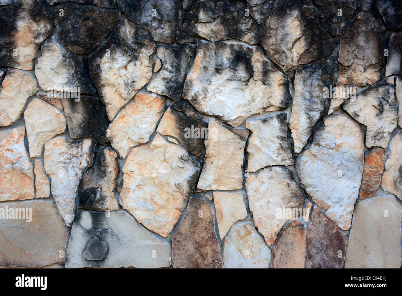 Sfondo di pietra. Il vecchio muro di pietra di granito. Foto Stock