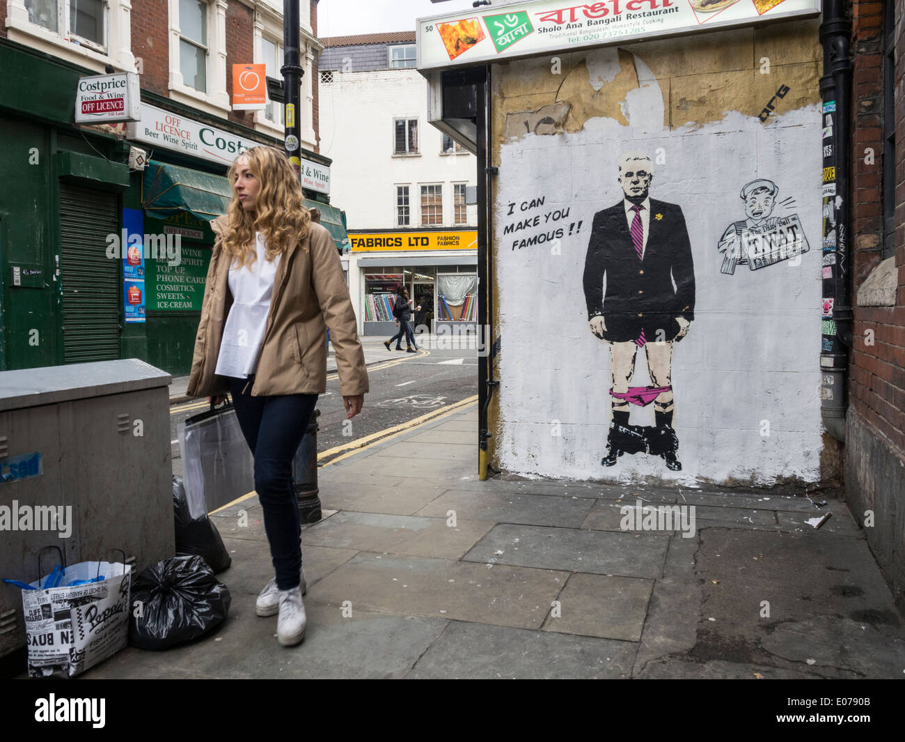 Arte di strada nella zona est di Londra che mostra Max Clifford dall'artista T.WAT Foto Stock