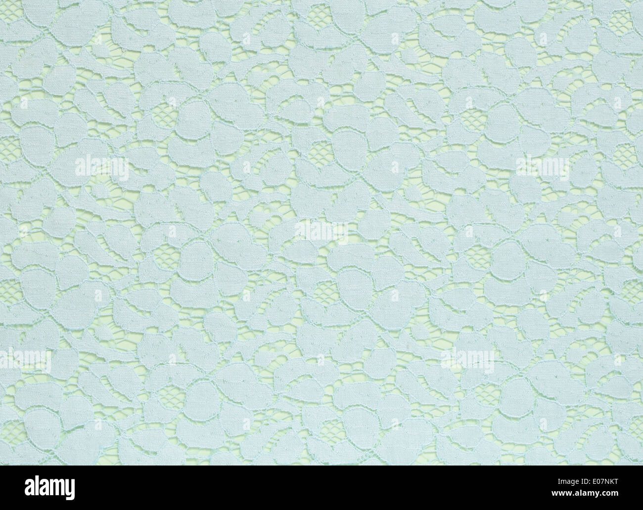 Azzurro texture di pizzo su una luce di sfondo verde Foto stock - Alamy