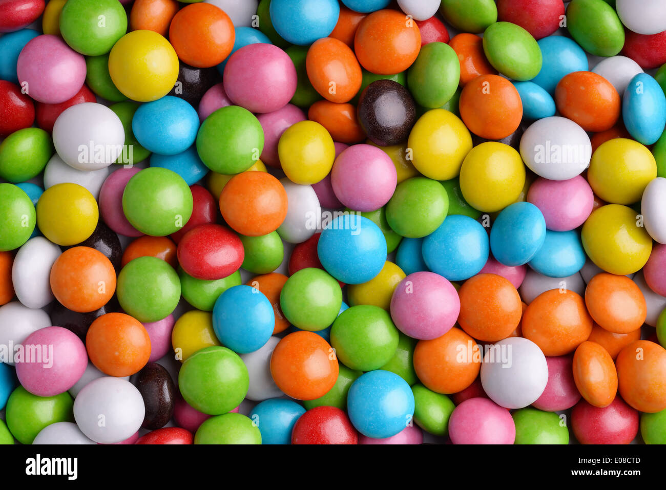 Sfondo di caramelle colorate scende Foto Stock