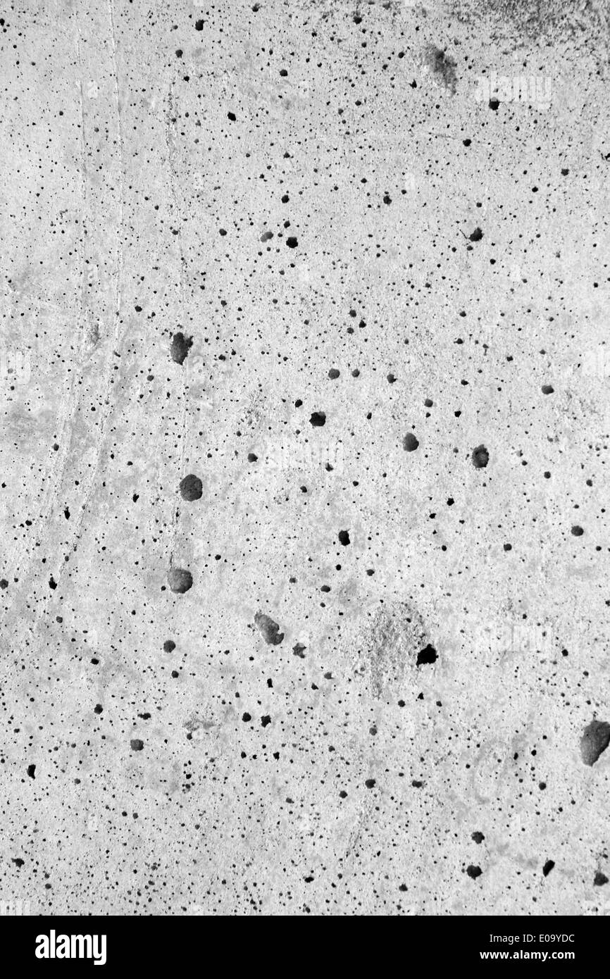 Frammento di un muro di cemento come la superficie della luna. Sfondo di calcestruzzo. Foto Stock
