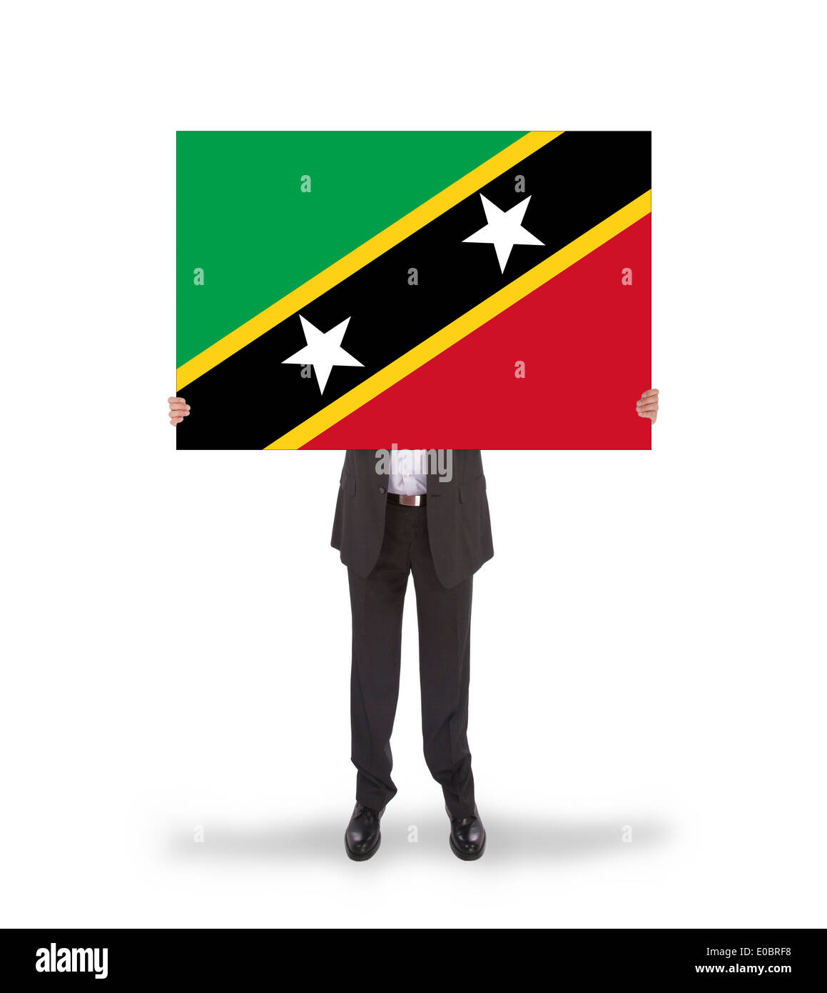 Imprenditore in possesso di una carta di grande bandiera di Saint Kitts e Nevis Foto Stock