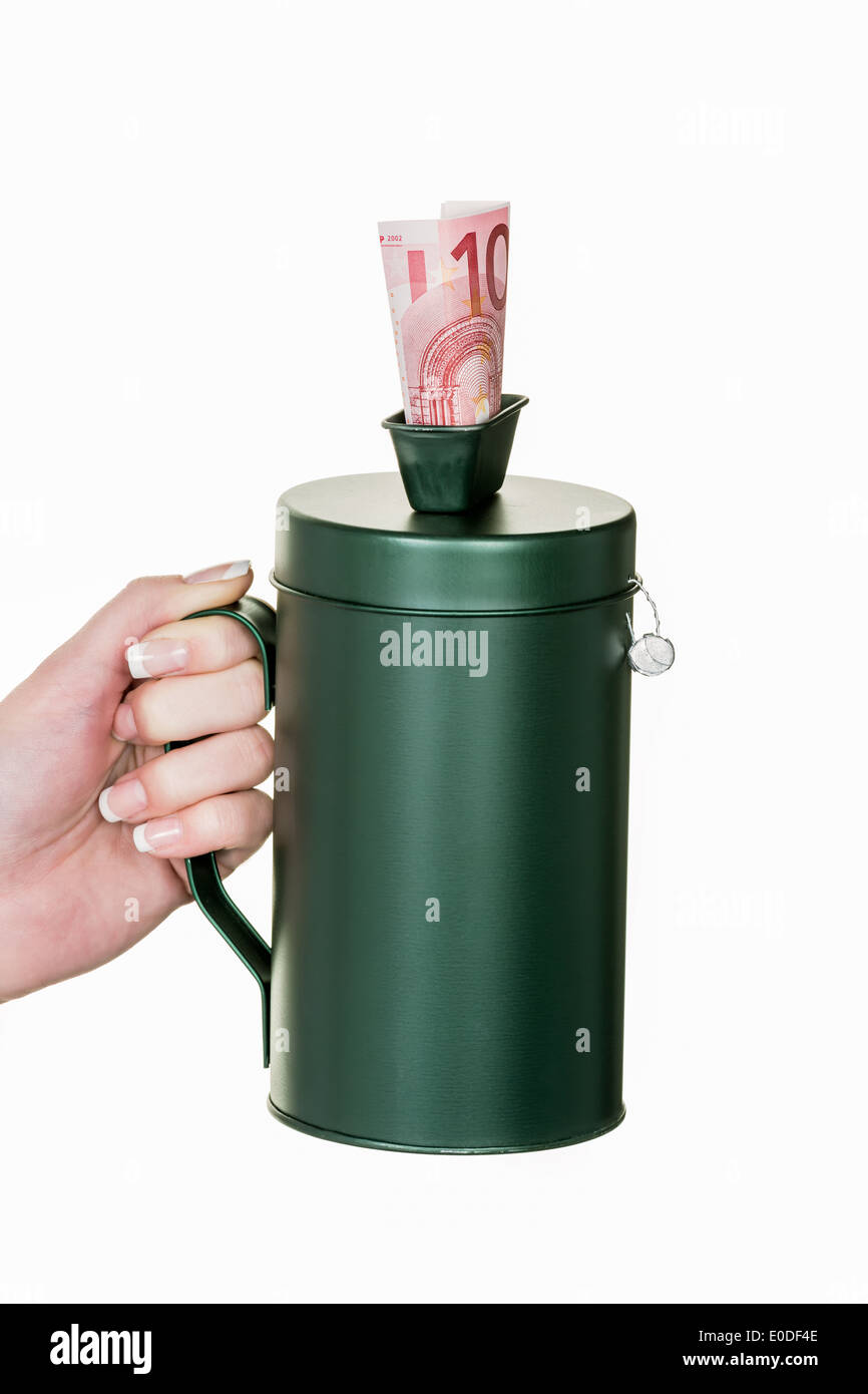 Mano con donazione di stagno, di mano Spendendose mit Foto Stock
