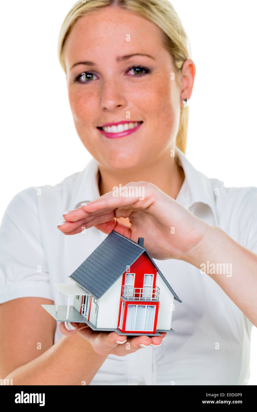 Un broker per immobili con una casa e una chiave. Il successo di noleggio e vendita di case da agenti immobiliari., Ein Makler fuer Immobilie Foto Stock