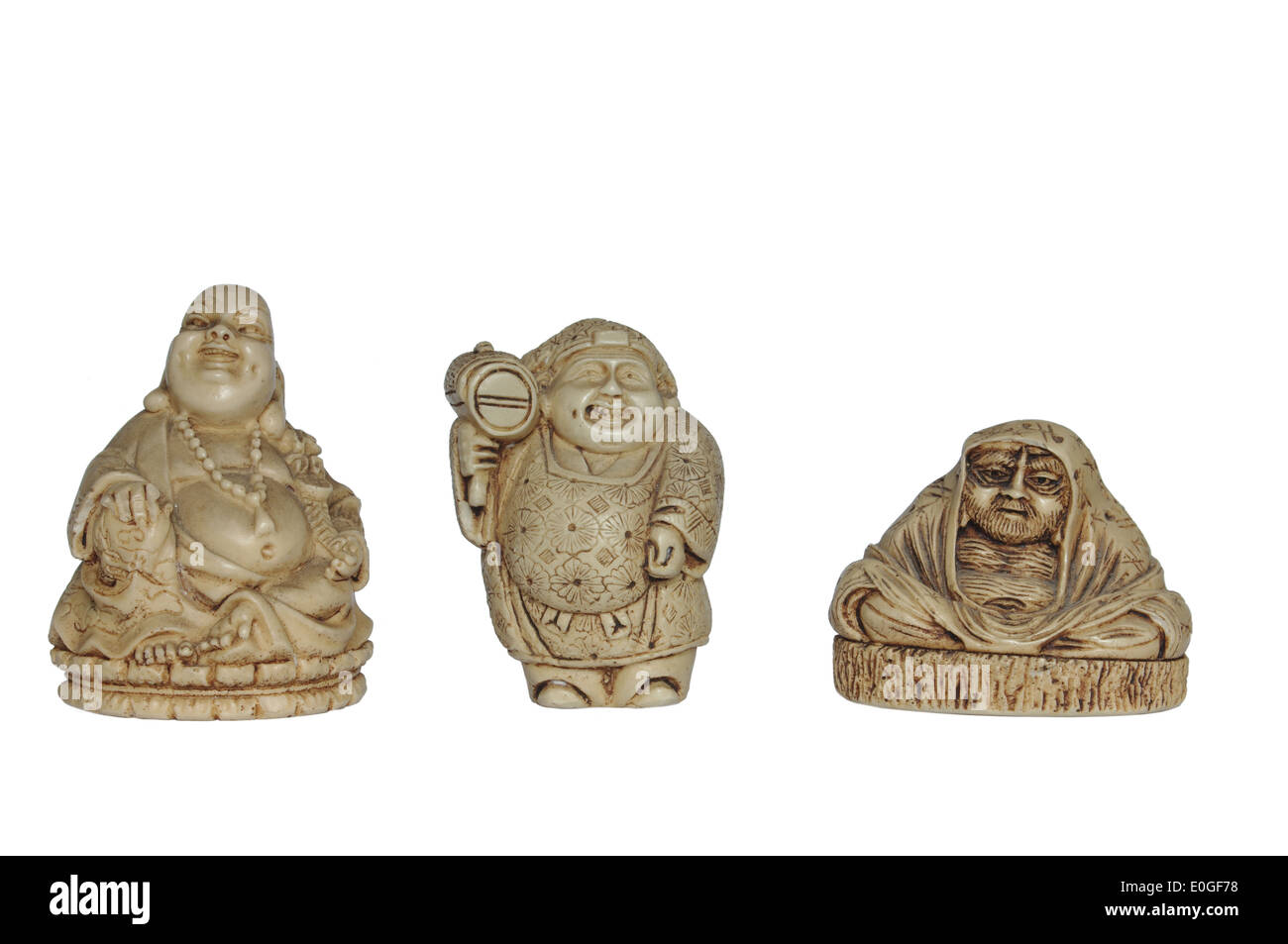 Tre figurine su sfondo bianco Foto Stock