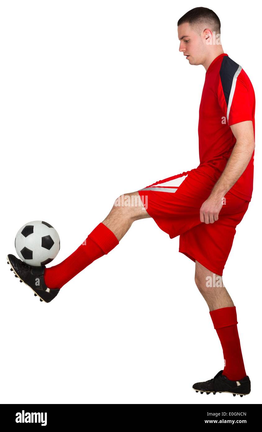 Montare il calcio giocatore giocare con sfera Foto Stock