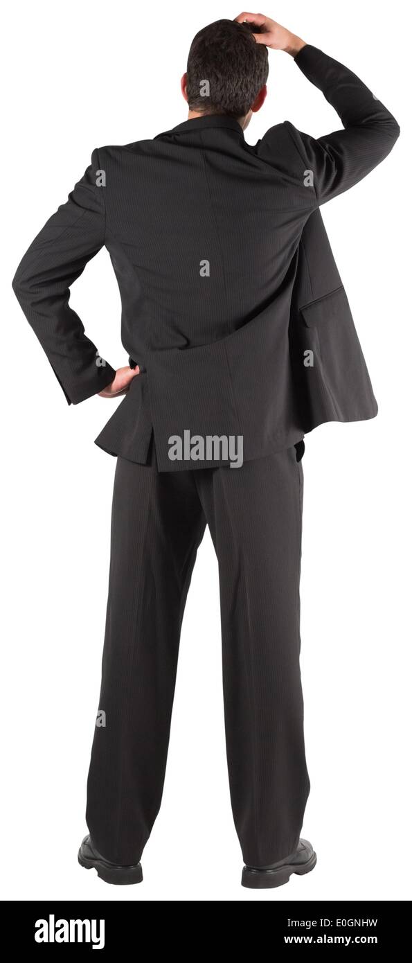 Imprenditore in piedi indietro per la fotocamera con la mano sulla testa Foto Stock