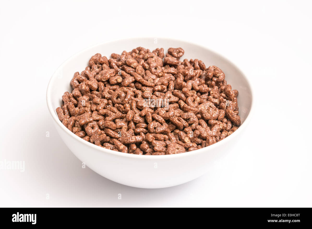 Ciotola bianca del cioccolato alfabeto lettere fiocchi di mais Foto Stock