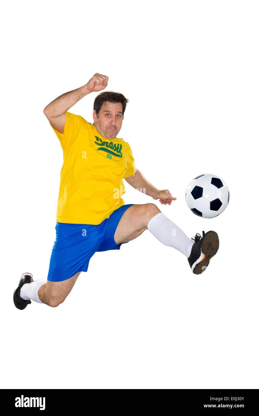 Calcio brasiliano player, saltando, giallo e blu Foto Stock Calcio brasiliano player, saltando, giallo e blu Foto Stock