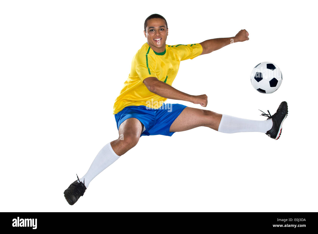 Calcio brasiliano player, saltando, giallo e blu Foto Stock Calcio brasiliano player, saltando, giallo e blu Foto Stock