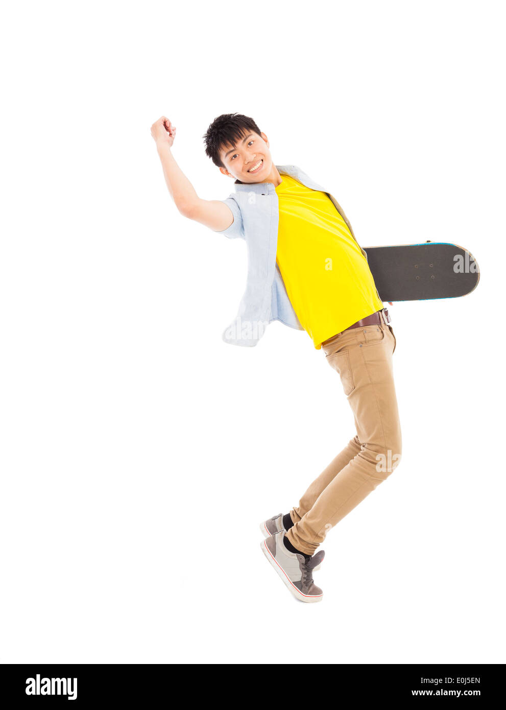 Vivace giovane azienda uno skateboard Foto Stock