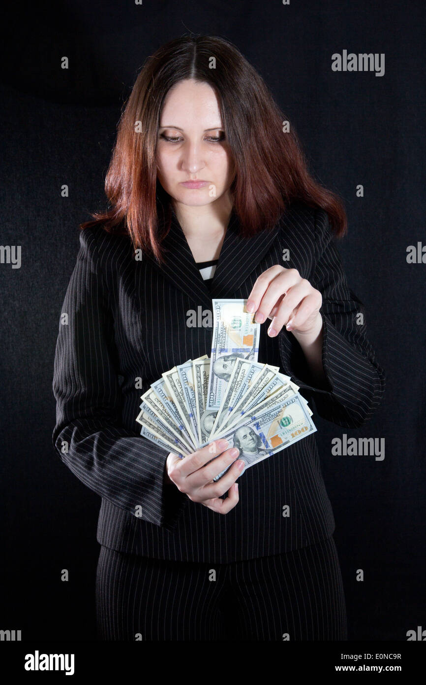 Ragazza mani denaro Foto Stock