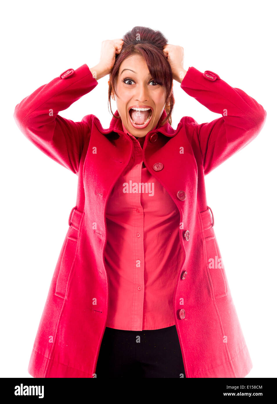 Indian giovane donna tirando i suoi capelli e urlando in frustrazione Foto Stock