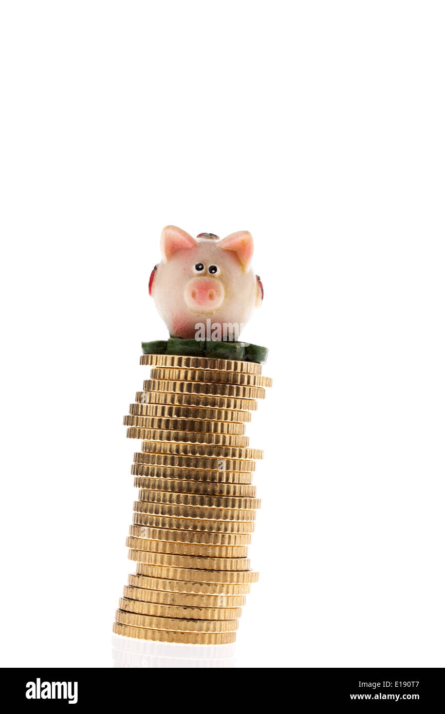 M'nzstapel von Eurom'nzen mit Sparschwein Foto Stock