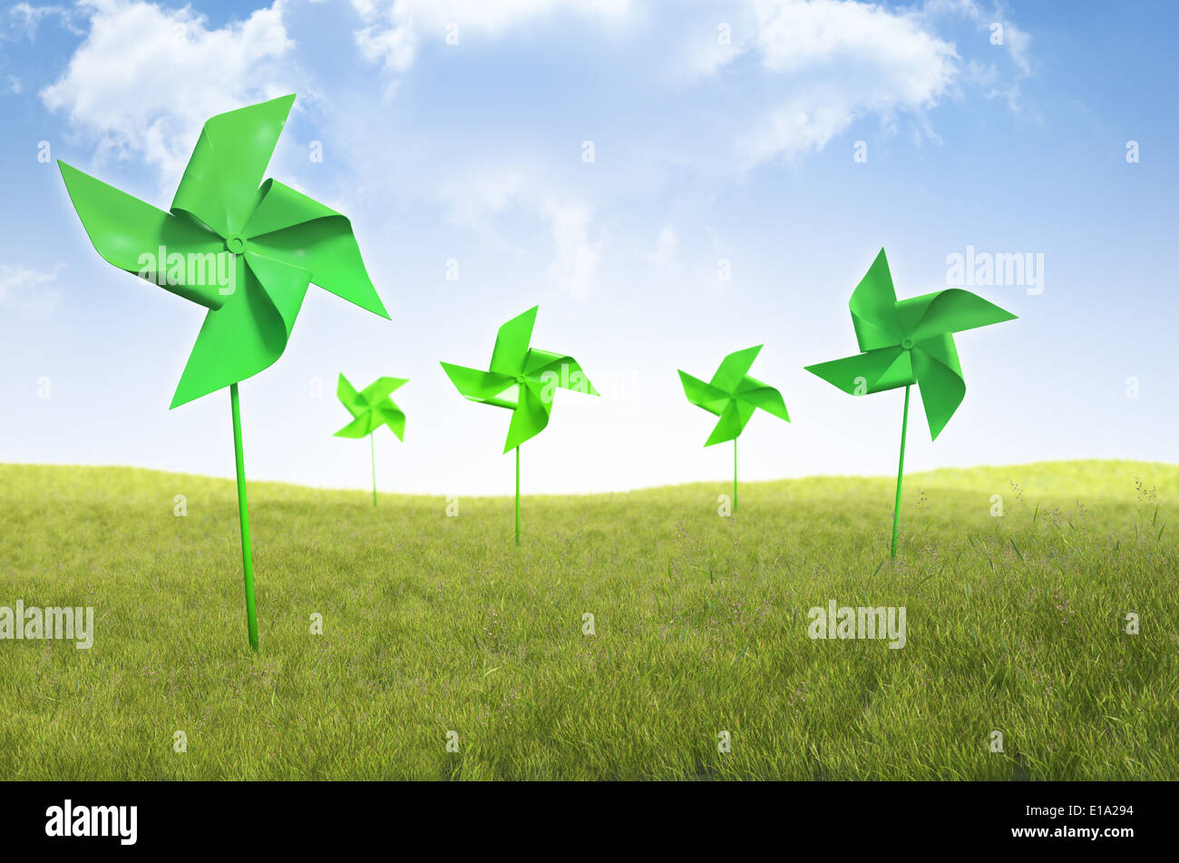 La girandola di mulini a vento in un campo di erba - Energie rinnovabili concetto Foto Stock