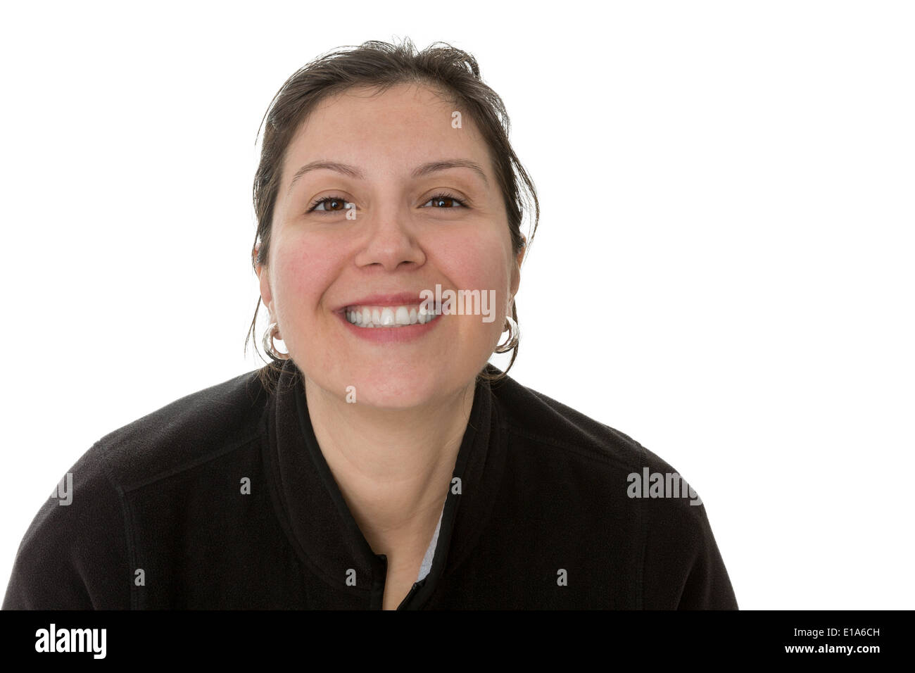 Donna informale cercando in ai vostri occhi pieni di gratitudine con un sorriso toothy Foto Stock