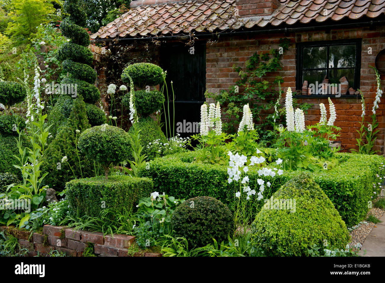 Il Topiarist giardino, un giardino artigianale al Chelsea Flower Show 2014, London, Regno Unito Foto Stock