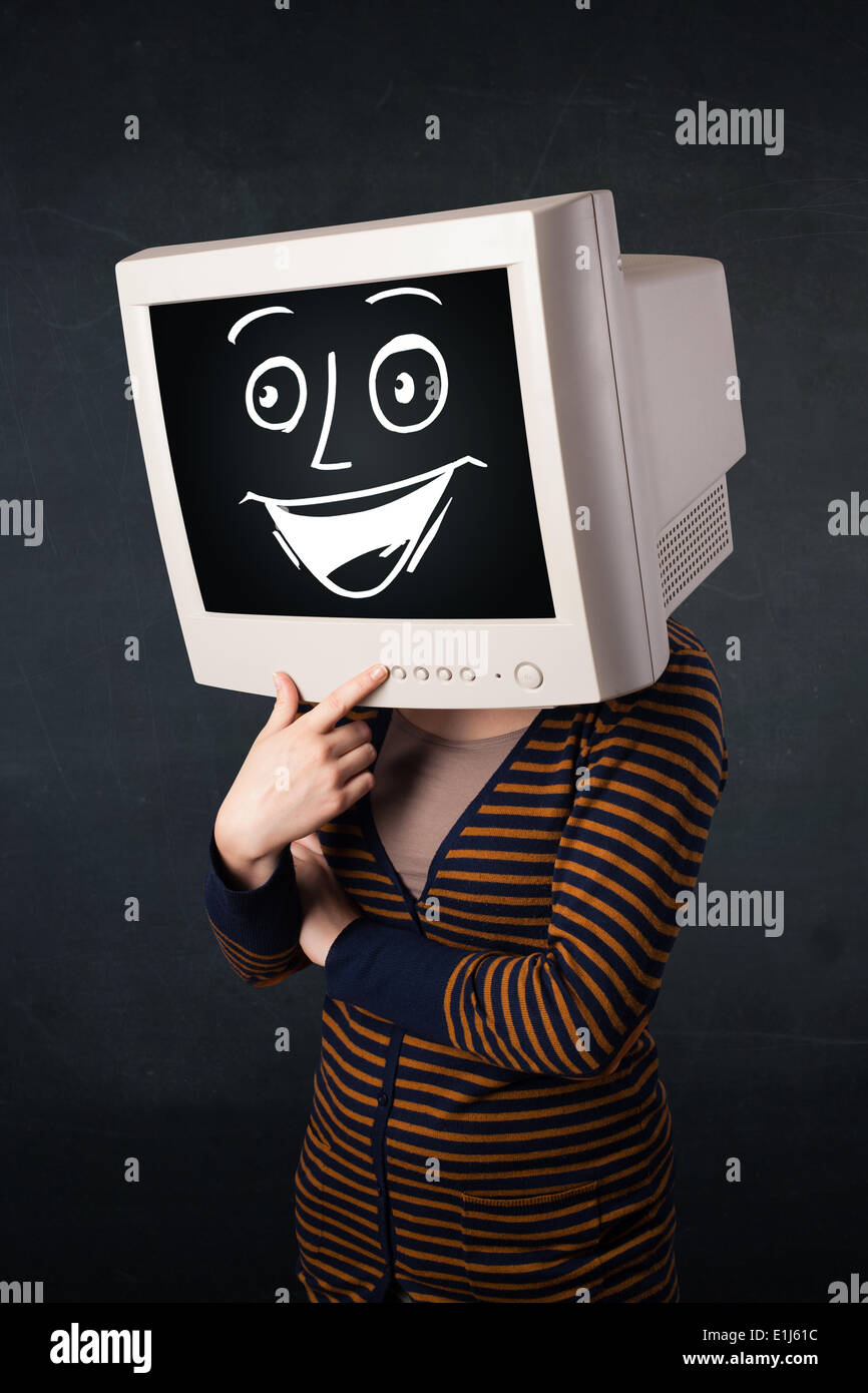 Ragazza con un monitor di testa e un allegro faccia cartoon Foto Stock