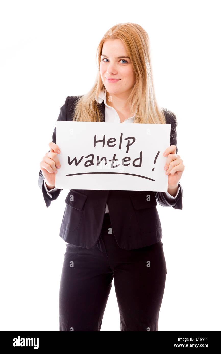 Imprenditrice tenendo una bacheca con le parole di testo 'Help wanted' Foto Stock