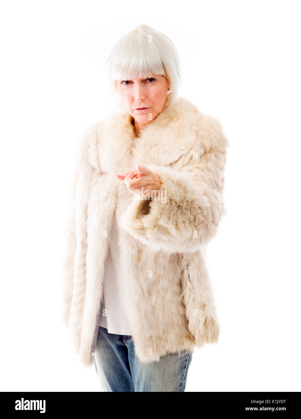 Senior donna rivolta verso la telecamera Foto Stock