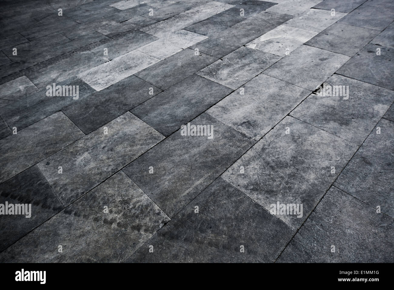 Pavimentazione urbana dello sfondo. Contrasto scuro colori. Foto Stock