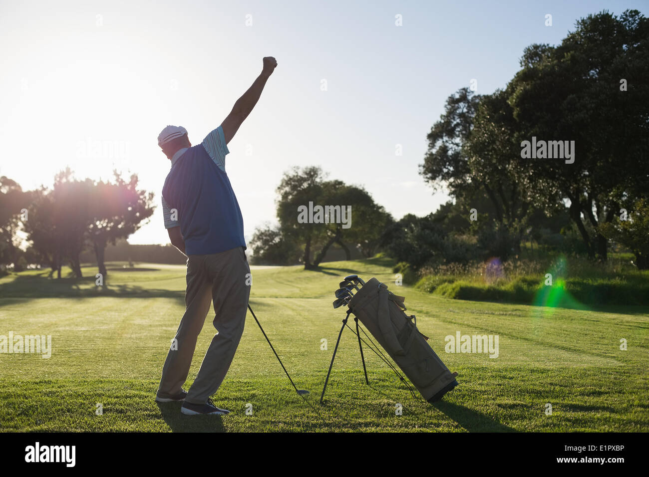 Il Golfer felice con la sua shot Foto Stock