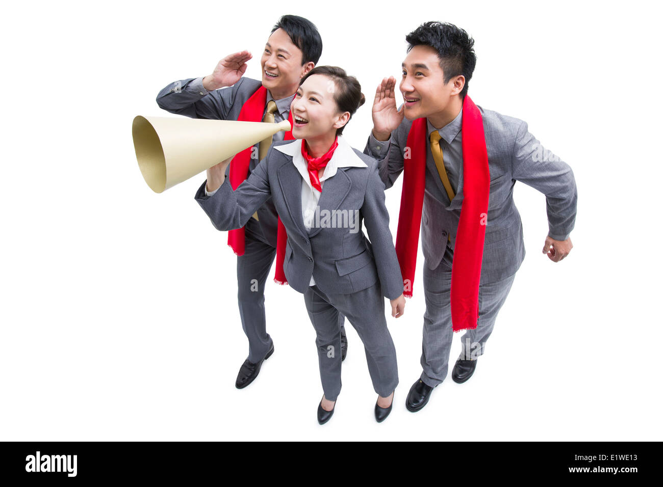 Happy business colleghi con un megafono Foto Stock