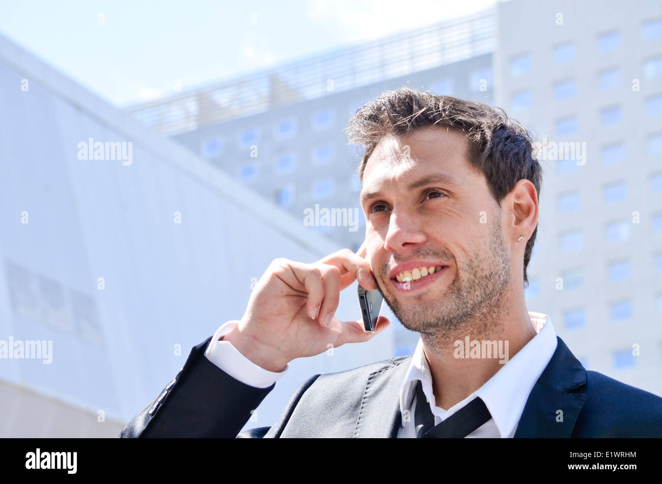 Imprenditore tramite telefono cellulare. Foto Stock