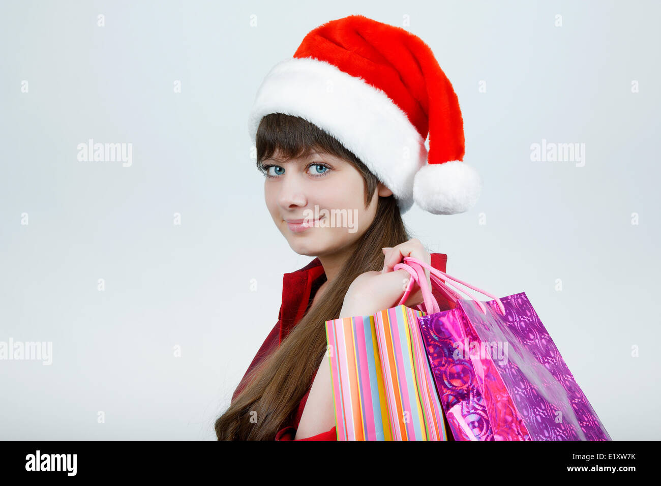 Una ragazza in un cappello di Natale Foto Stock