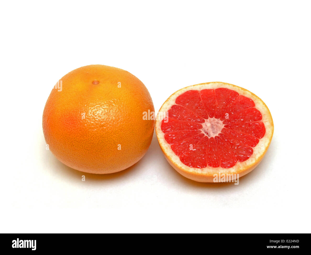 Uno e mezzo di pompelmi e di pomeli Foto Stock