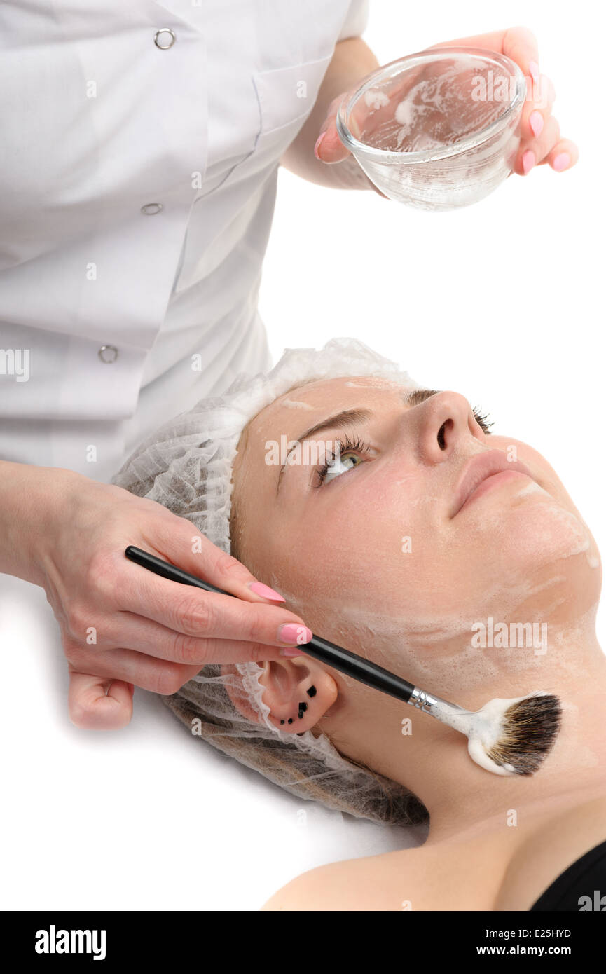 Salone di bellezza, maschera facciale applicazione Foto Stock