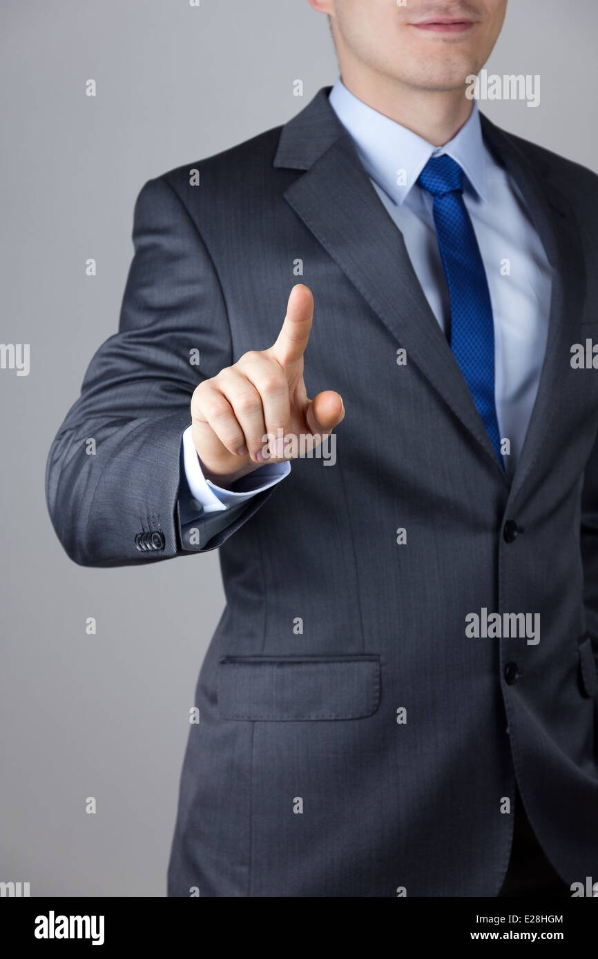 Business man toccando uno schermo immaginario Foto Stock