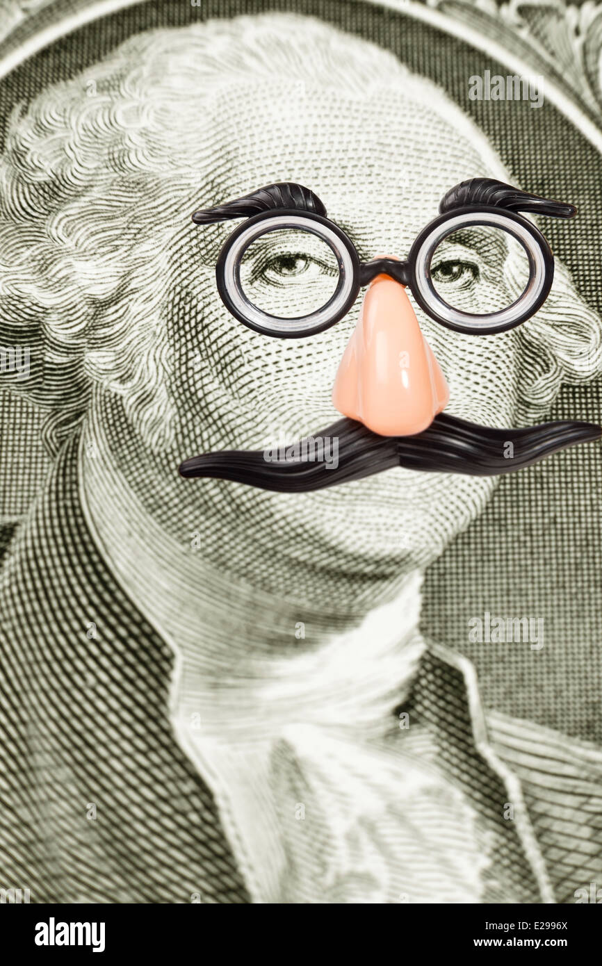 Novità di occhiali e i baffi su George Washington faccia. Close-up di un dollaro. Foto Stock