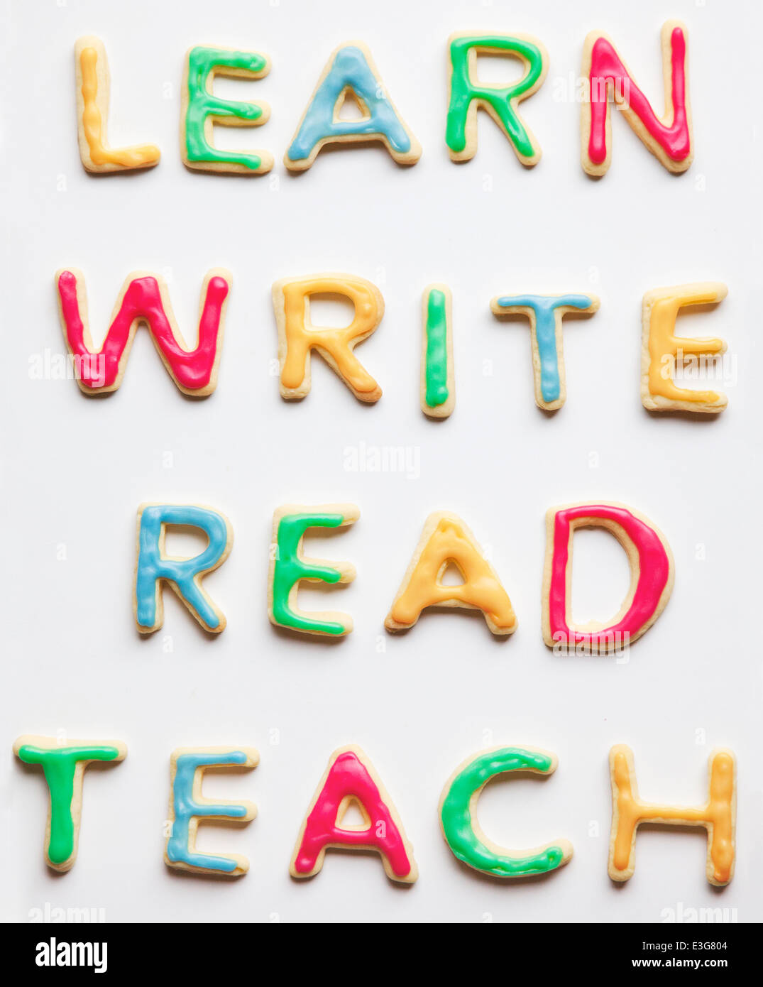 Per saperne di scrittura e di lettura insegnare decorate i cookie Foto Stock