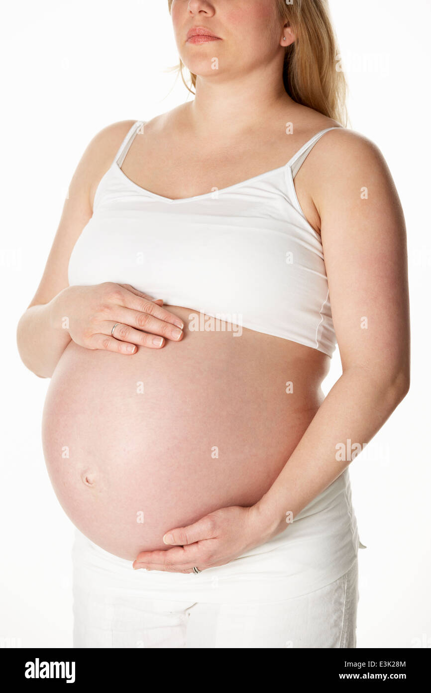 Close up Studio Ritratto Di Donna Incinta bianco da indossare Foto Stock