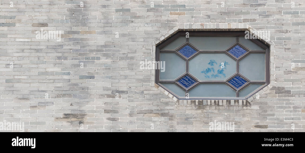 Cinese tradizionale finestra e muro di mattoni Foto Stock