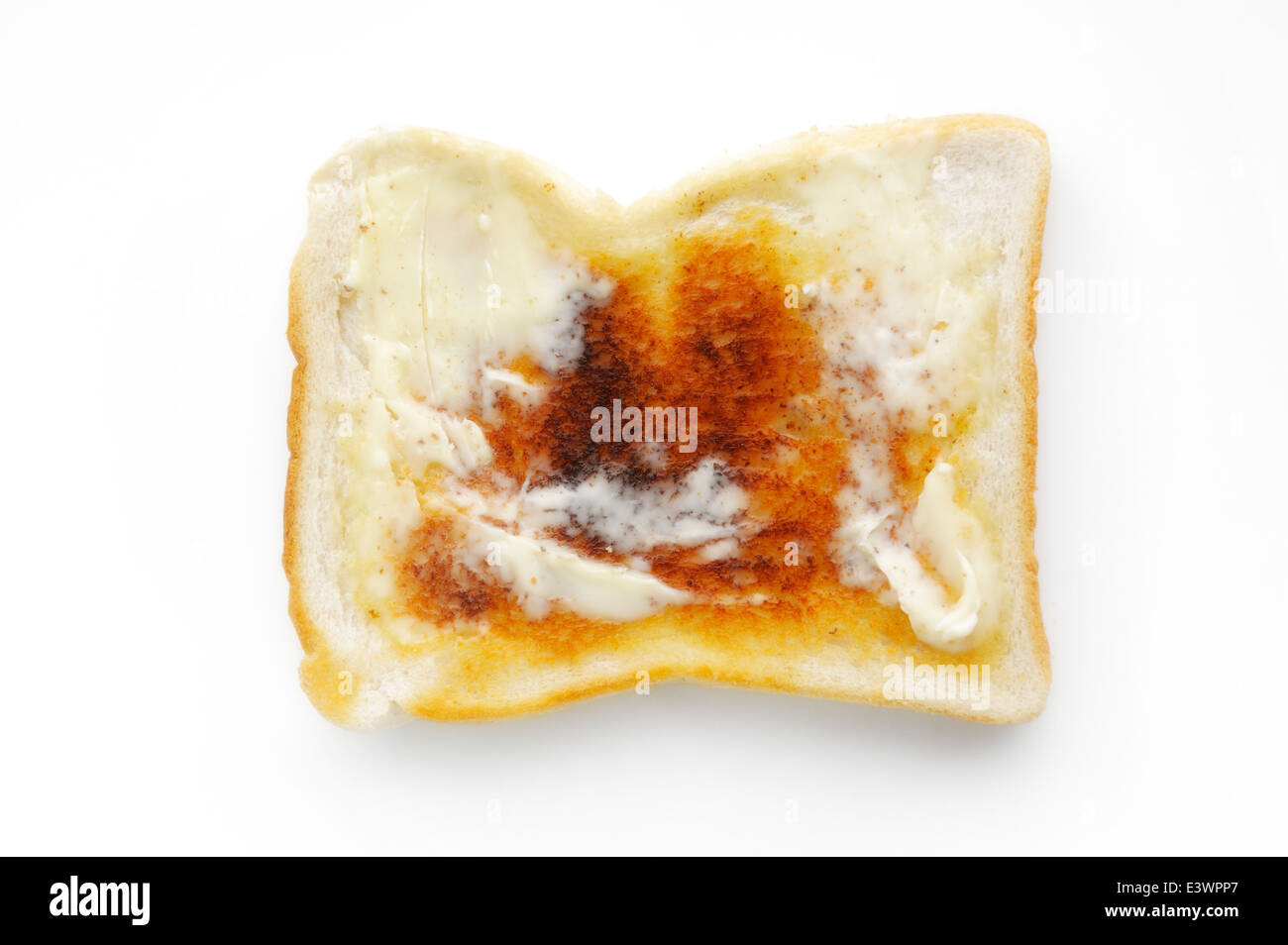 Una fetta di imburrato toast bianchi Foto Stock