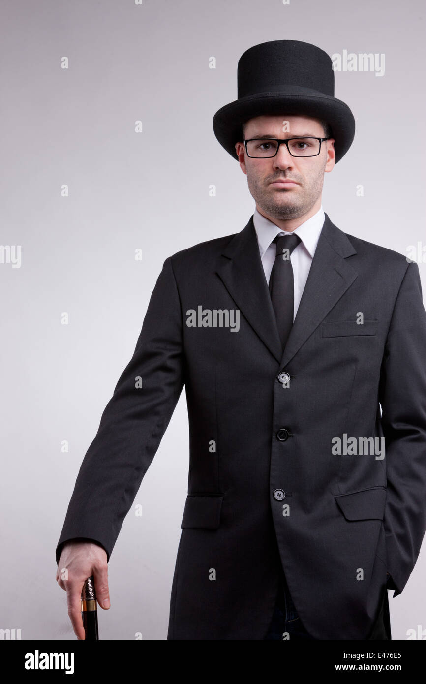 Signore black nerd con un cappello a cilindro e una canna da zucchero Foto  stock - Alamy
