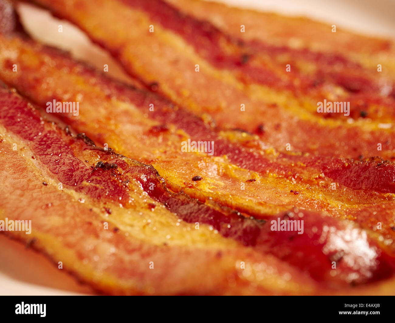 Bacon cotto listelli Foto Stock