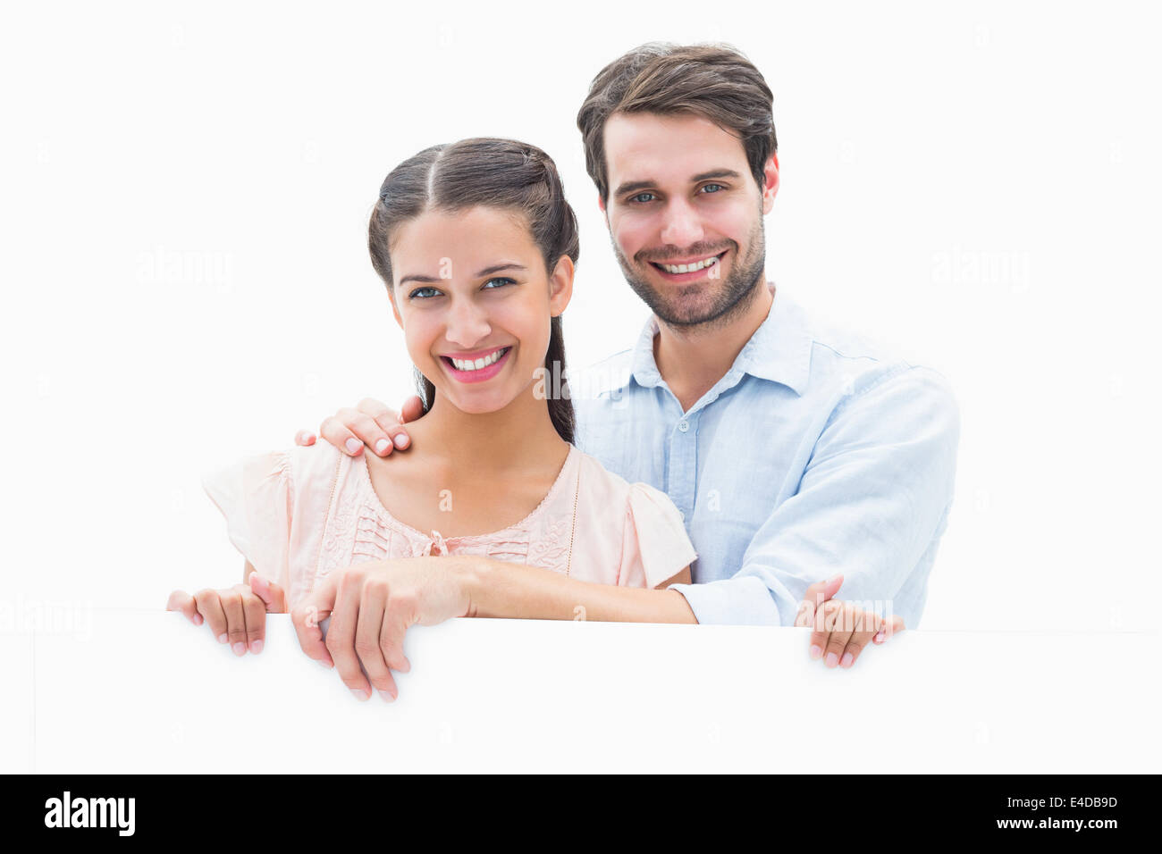 Attraente giovane coppia sorridente in telecamera Foto Stock