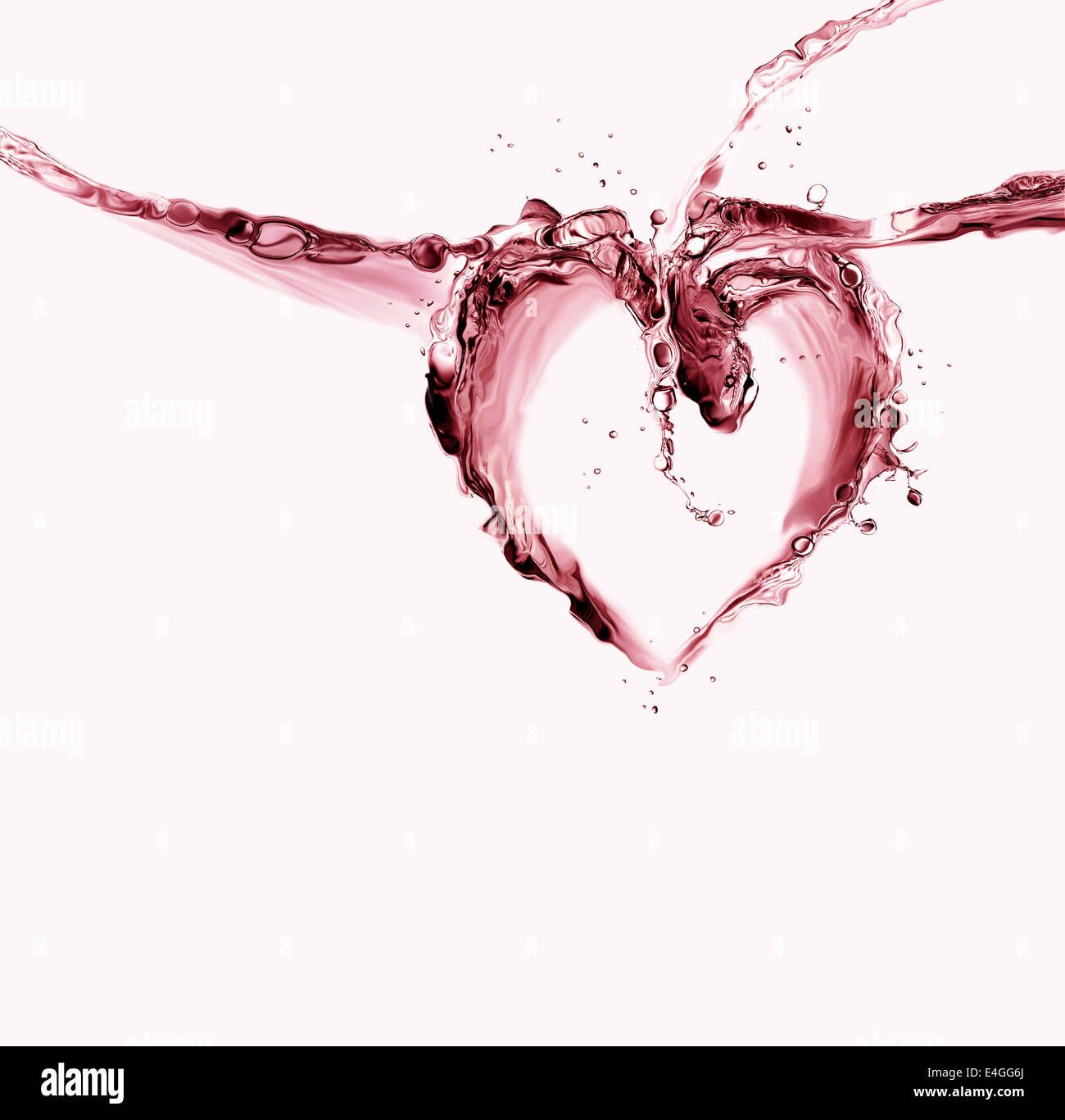 Un cuore fatto di rosso di spruzzi di liquido. Foto Stock