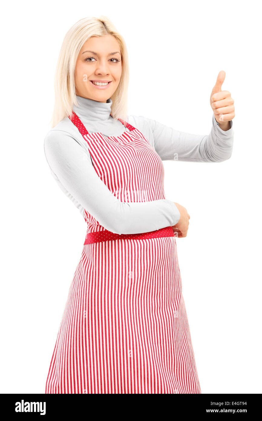 Donna con un grembiule dando un pollice in alto Foto Stock