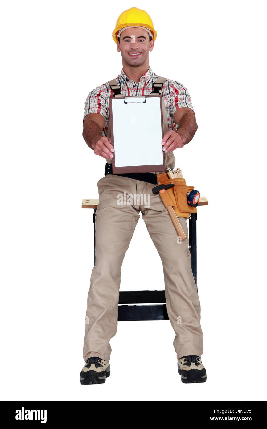 Lavoratore holding clip-board Foto Stock