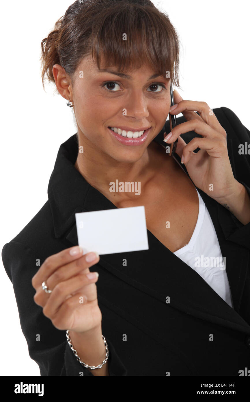 Donna del numero del chiamante sul business-card Foto Stock