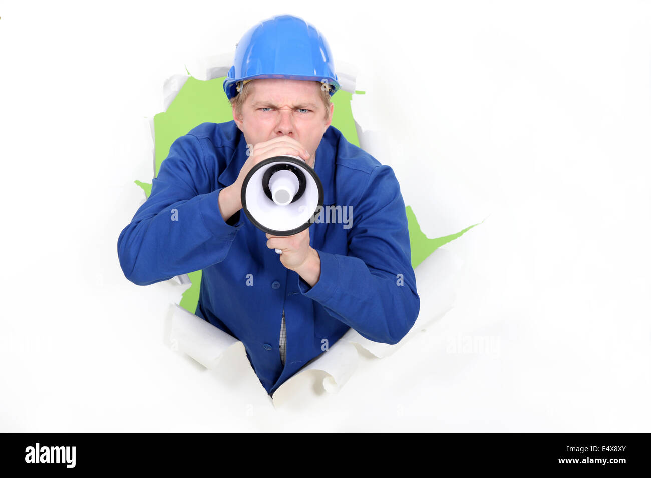 Un lavoratore manuale con un megafono. Foto Stock