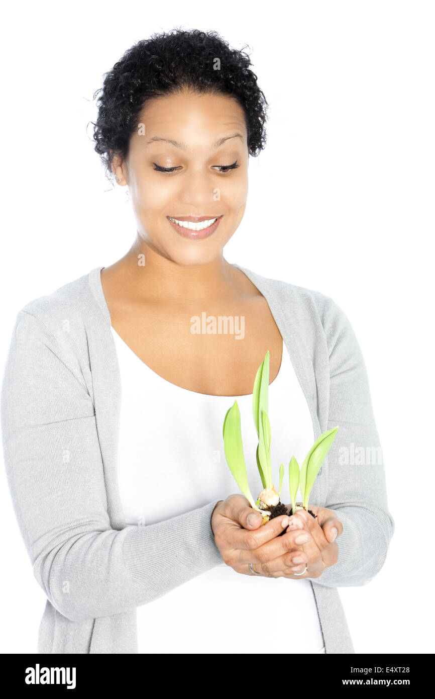 African American donna hollding un impianto Foto Stock