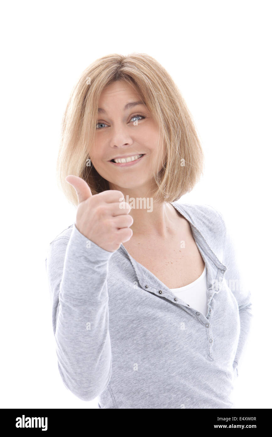 Felice donna informale dando un pollice in alto Foto Stock