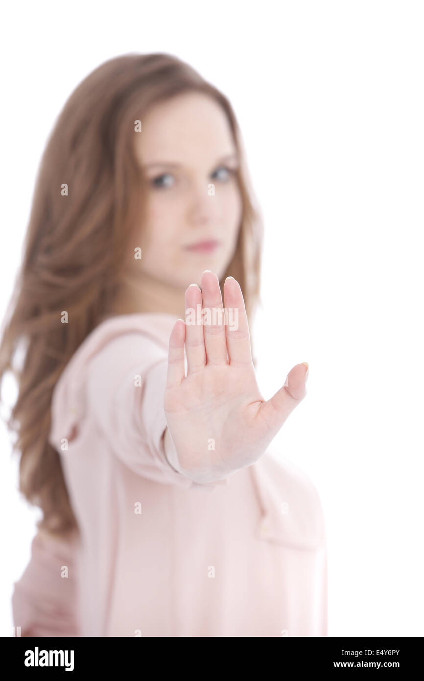 Giovane donna dando un gesto di arresto Foto Stock