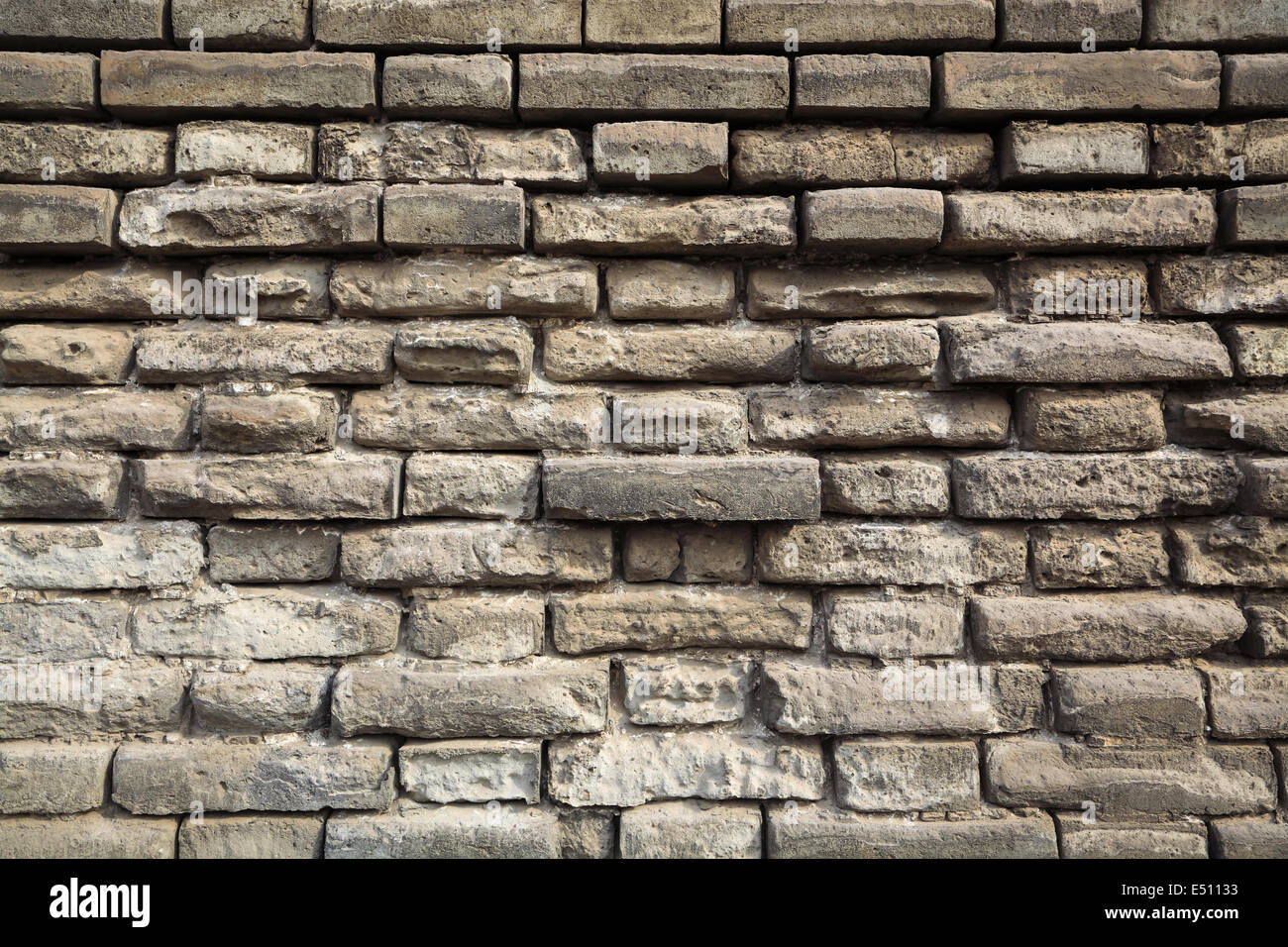 Weathered grigio a muro in mattoni Foto Stock